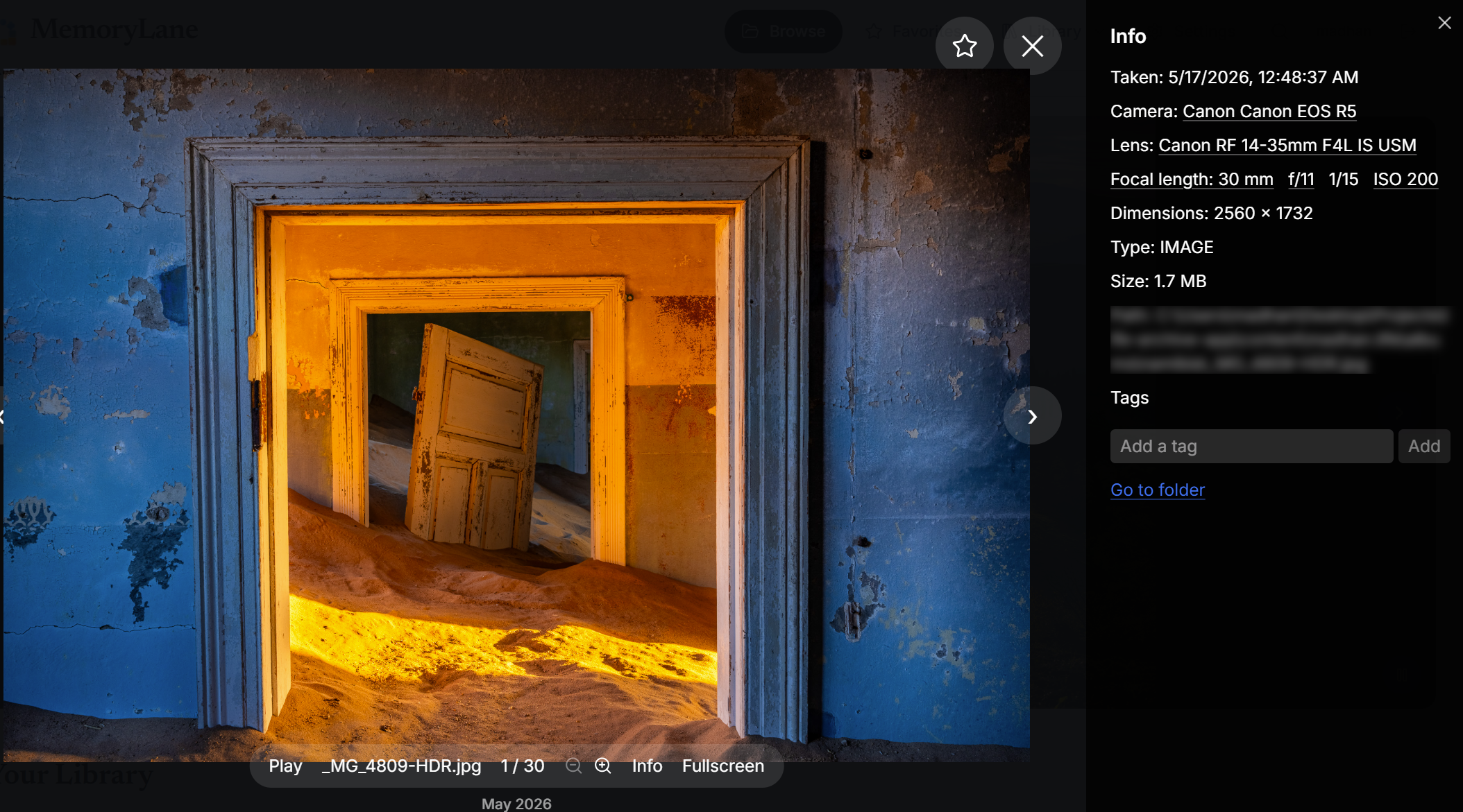 MemoryLane fullscreen photo viewer showing zoom controls, image metadata, tags, and camera details